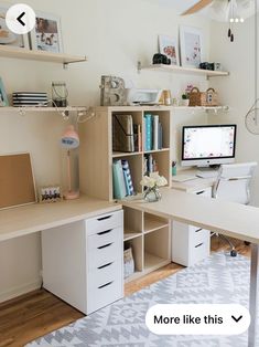 a desk with a computer on top of it in front of a book shelf filled with books