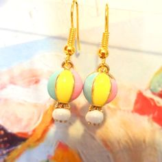 Pastel Summertime Hot Air Balloon Chained Basket Gold Tone Earrings Colorful- Light Pastel Colors, Paint Is Enamel Hot Air Balloon. Gold Tone. French Hook Dangle Earrings. Adorable And Fun Hot Air Balloon Earrings Especially If You Are Really Into Hot Air Balloons Great Gift Choice For Any Occasion- Birthday, Christmas, Easter, Valentine's Day, Mother's Day Noveltyearrings #Ballons #Hotairballon #Drsuess #Rainbow Pastel Trendy Kidcore Abstractnretro Brushed Painted Modern Popart Funky Artsy Arti Hot Air Balloon Polymer Clay Earrings, Pink Hot Air Balloon, Colorful Hot Air Balloons, Hot Air Balloon Jewelry, Novelty Multicolor Dangle Jewelry, Hot Air Balloon Earrings, Balloon Earrings, Balloon Chain, Balloon Skirt