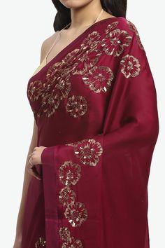 Wine saree embroidered with floral gold zari and sequins. Comes with matching running blouse piece. - Aza Fashions Eid Silk Pre-draped Saree With Gota Work, Gold Pre-draped Georgette Saree With Resham Embroidery, Navratri Celebration Pre-draped Saree With Zari Work, Festive Celebration Pre-draped Saree With Gota Work, Eid Georgette Pre-draped Saree With Gota Work, Traditional Georgette Pre-draped Saree For Celebration, Pre-draped Georgette Saree For Celebration, Festive Pre-draped Saree With Gota Work, Bollywood Silk Saree For Reception