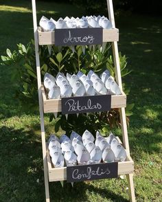 a wooden ladder with two signs on it that say sweets and devil's heads