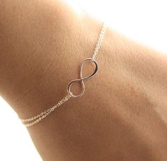 "Welcome to BijouxbyMeg! Handcrafted jewelry, personalized just for you :) ★Please be sure to take note of my current processing times (which does not include shipping time) in the \"Shipping & Policies\" tab above▲▲ ❤ Dainty Infinity Bracelet♥ The most simple & delicate everyday bracelet. A very dainty sterling silver infinity charm (20mm) floats amongst two layers of the most dainty & shimmering sterling silver chain. Bracelet is completed with a round spring clasp. ★★Need help with your brace Gold Infinity Bracelet, Infinity Bracelets, Silver Infinity Bracelets, Bridesmaids Gift Sets, Delicate Feminine, Everyday Bracelet, Cherry Hill, Friendship Jewelry, Sterling Silver Anklet