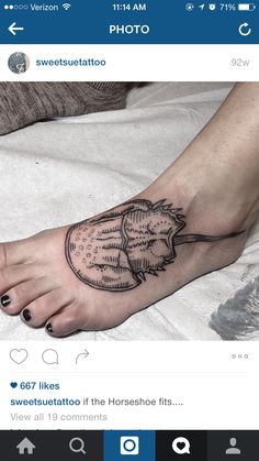 a person's foot with a tattoo on it