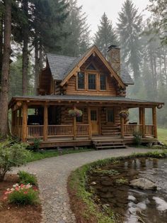 a log cabin with a stone pathway leading to it