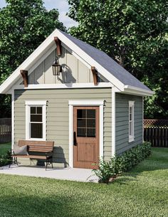 a small shed with a bench in front of it