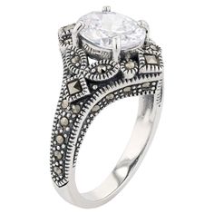 Light up your look with the dazzling style of this Lavish by TJM cubic zirconia and marcasite ring.Click on this JEWELRY & WATCHES GUIDE to learn about fit, styles, materials and more! Width: 0.84 in. Nickel free Metal: sterling silver Plating: rhodium Finish: oxidized Marcasite accents Packaging: boxedSTONE DETAILS Stone type: cubic zirconia Total weight: 3 3/8 ct. Center stone weight: 3 1/10 ct. Center stone size: 9 mm x 7 mm Shape: oval Setting: prong Gemstones may have been treated to enhanc Oval Setting, The Dazzling, Marcasite Ring, Womens Jewelry Rings, Rings Statement, Statement Rings, Light Up, Cubic Zirconia, Jewelry Watches