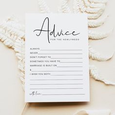 the advice card is placed on top of some white paper with black writing and leaves