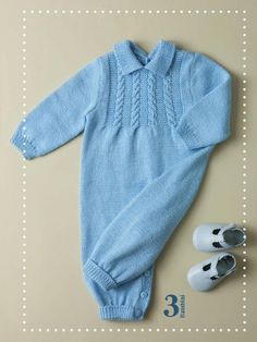 a baby's blue sweater and pair of white shoes