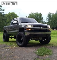 a large truck parked in the middle of a field