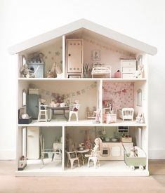 a doll house with furniture and accessories in it