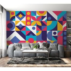 a living room with a large colorful mural on the wall