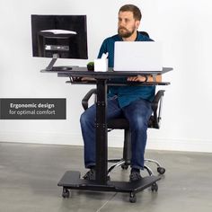 a man sitting at a desk using a computer