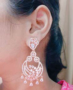 American Diamond Rose Gold / silver Plated Dangle EARRING Set for Women and girl Designer Party wear Bridal CZ Indian Traditional Jewellery  You can wear your jewellery with confidence, knowing that each Electrifying Jewellery piece comes with a manufacturing warranty and a satisfaction guarantee. MATERIAL: Environmental Brass Alloy with Top Quality Genuine Plating, World-class Craftsmanship, TSB Collection makes people remember not only the jewellery itself, but also the woman who wears that jewellery. JEWELLERY CARE: It is advisable to store jewellery in a zip lock pouch (air tight pouch), keep away from water perfume and other chemicals and clean it with dry and soft cloth. LUXURY GIFTING IDEA: Give a meaningful and luxurious gift with Electrifying Jewellery. A favourite gift choice, ea Dazzling Hand Set Bridal Earrings For Party, Hand Set Cubic Zirconia Chandelier Earrings, Dazzling Hand-set Chandelier Earrings For Party, White Hand Set Chandelier Earrings For Party, Dazzling Party Chandelier Earrings Hand Set, Silver Danglers With Elegant Design For Festive Occasions, Sparkling Rose Gold Bridal Earrings For Party, Festive Silver Danglers With Elegant Design, Hand Set White Bridal Earrings For Party