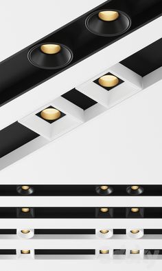 three lights that are on the side of a white and black wall mounted light fixture