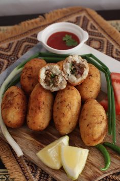 some food is sitting on a wooden plate