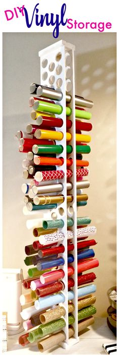 the diy vinyl storage rack is filled with many different colored spools