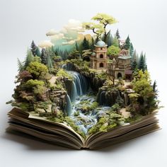 an open book with a waterfall in the middle and trees around it, on top of a white surface