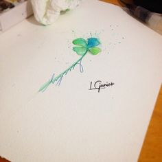 a piece of paper with a flower drawn on it