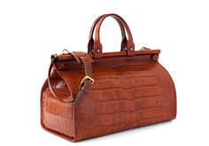 a brown alligator skin handbag on a white background