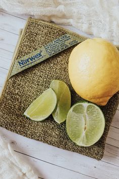 a lemon and lime slices on a towel