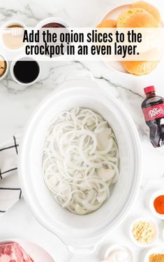 noodles in a white bowl with the words add the onion slices to the crockpot in an even layer