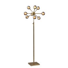 a floor lamp with five lights on it and a square base in the shape of a flower