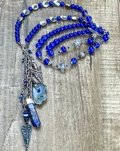 This is a beautiful one of a kind beaded blue stone and crystal charm necklace. Semi precious Stones. Crystal charm. This necklace is made 36 inches long and has an adjustable silver chain. Beaded charm necklace.  Necklaces can be made any size, color or style. Please send me a message if you would like a certain size, color, or style made especially for you!  Thank you for visiting and shopping 27inHeaven! ❤️ Michelle Hoeft