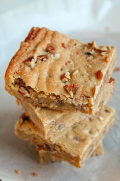 three pieces of pecan bar stacked on top of each other