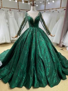 a green ball gown on display in a store