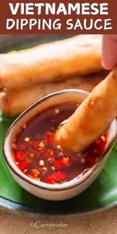 vietnamese dipping sauce in a small bowl on a green plate