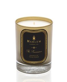 a candle that is sitting in front of a white background with the words harlem on