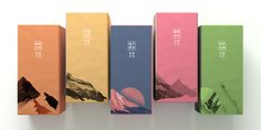 five colorful boxes are lined up on a white surface with chinese characters painted on them