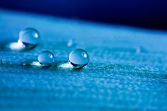 three drops of water sitting on top of a blue surface with the words what's the most remarkable thing you've ever heard someone say?