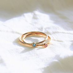 These tiny birthstone rings are perfect alone or stacked. Wear a few with our beaded band, plain band or even our heart ring. They make a wonderful birthday gift, unique and meaningful. Ideas for stacks: -children's birthstone -significant other birthstone or plain band -trio of sisters or friends -beaded band for angel baby -tiny heart ring -thin plain bands -2mm plain band Create a stack that tells your story!! -Thin 14kt gold filled band -Wear alone or perfect for stacking -bezel crystal to r Birthstone Rings, Plain Bands, Angel Baby, Birthday Ring, Mother Birthday Gifts, Stacked Jewelry, Tiny Heart, Dainty Ring, Birthstone Ring