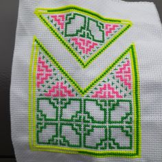 a close up of a piece of cloth with designs on it