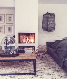 a living room filled with furniture and a fire place