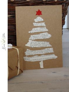 a brown card with a christmas tree drawn on it next to a wrapped present box