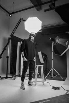 a man is standing in front of some lighting equipment