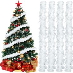 a christmas tree with white feathers and red balls on it next to a pile of presents