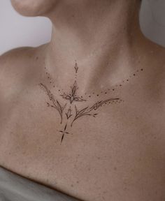 a woman with a cross tattoo on her chest