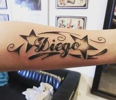 a tattoo with the word diego written in cursive writing on it's arm