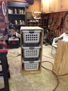 the storage area is filled with many different types of baskets and tools, including one for bicycles