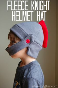 a little boy wearing a helmet with the words fleece knight helmet hat