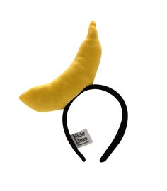 Complete your fun look this season with this Large Yellow Banana Headband Hat. Perfect for Men, Women, and Teens! Each yellow banana headband features is lightweight and comfortable to wear. Easy to wear, simply slide over the head. Each banana headpiece is made of polyester. This fun banana headdress is about 7.5 inches long and has a width of about  2 inches. This mini hat is great for Crazy Hat Day, a Parade, Halloween, Cosplay, Pretend and more! Spot clean only. For Ages 14 and Older. 🍌Large Yellow Banana fruit headband. Perfect for Men, Women, and Teens! Lightweight and comfortable to wear. 🍌Easy to wear, simply slide over the head! This fun banana hat is about 7.5 inches long and has a width of about 2 inches. 🍌Each Crazy Banana is on a lightweight comfortable headband. Perfect fo Banana Headpiece, Bananas In Pajamas Costume, Bananas In Pyjamas Costume, Fruit Headband, Banana Hat, Fun Cosplay, Banana Costume, Banana In Pyjamas, Fruit Costumes