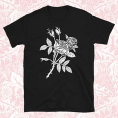 Original Rose illustration by Distant Planet Design Don't see the size you need? Want it on a sweater or tank top? Don't hesitate to message me--we can make something happen together! == You've now found the staple t-shirt of your wardrobe. It's made of a thicker, heavier cotton, but it's still soft and comfy. And the double stitching on the neckline and sleeves add more durability to what is sure to be a favorite! * 100% ring-spun cotton * Sport Grey is 90% ring-spun cotton, 10% polyester * Dar Spring Aesthetic Graphic Print T-shirt, Spring Aesthetic Graphic T-shirt, Floral Print Short Sleeve T-shirt For Streetwear, Short Sleeve Floral Print T-shirt For Streetwear, Vintage Short Sleeve T-shirt With Plant Print, Streetwear Short Sleeve Floral Print T-shirt, Short Sleeve Floral Print Streetwear T-shirt, Vintage T-shirt With Plant Print, Short Sleeve, Streetwear Floral Print Short Sleeve T-shirt