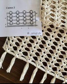 a crocheted doily with a name tag on it