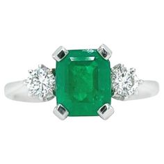 This 18K white gold classy ring is from our Timeless Collection. It is made of a cushion shape emerald 1.51 Carat decorated by 2 colourless round diamonds in total of 0.32 Carat. Total metal weight is 3.80 gr. Beautiful piece of jewellery! ' The Timeless Collection was inspired by the endless elegance and sophistication of classic high-jewelry, eternising it’s beauty and presenting a selection of classy designs. The intense colours stones give the collections authenticity making it memorable and Classy Ring, Gold Cushions, Diamond Cocktail Rings, Emerald Diamond, Intense Colors, High Jewelry, Cocktail Rings, Timeless Pieces, Stone Color