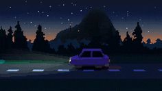 a car is driving down the road in front of some trees and buildings at night