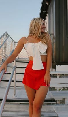 Stay cute and comfy on game day with The Tailgate Skort - the red skort that will keep you looking great while you cheer for your team! No need to sacrifice style for comfort - this skort is the perfect combination of both, and it's perfect for any fan that wants to show their spirit. Go team! available for in store credit or exchange (see policy for more info) filter used to brighten photos Summer Cheerleading Skort, Red Tops For Day Out, Red Short Tops For Day Out, Red Bottoms For Cheerleading In Summer, Red Shorts For Summer Cheerleading, Red Cheerleading Shorts For Summer, Casual Summer Cheerleading Skort, Red Skort With Built-in Shorts, White Mini Skirt For Cheerleading Summer