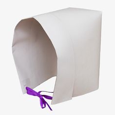 a white paper bag with purple ribbon tied to it's side and an opening on the inside