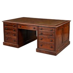 an old wooden desk with drawers on it